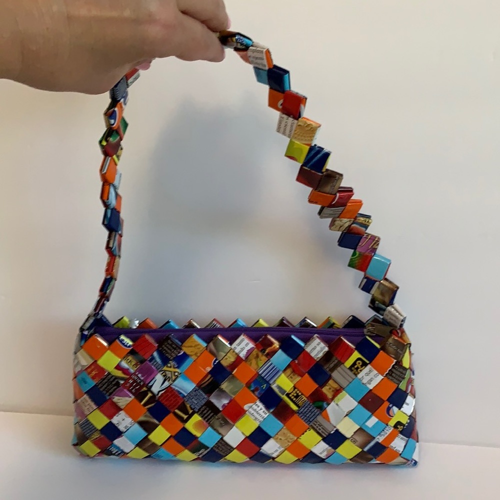 Hand woven recycled plastic candy wrap handbag